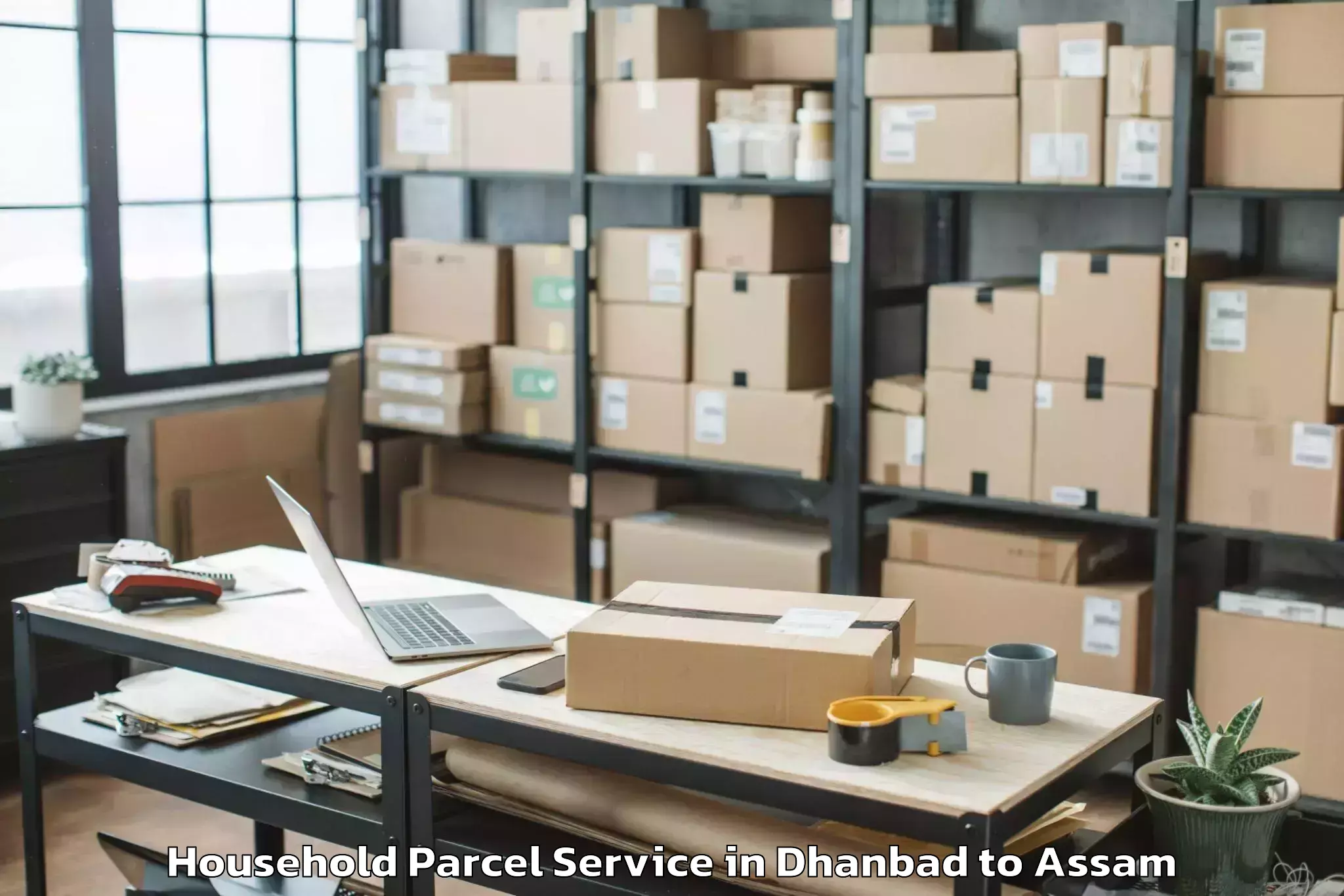 Dhanbad to Lalapur Hailakandi Household Parcel